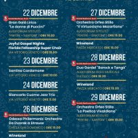 Poster eventi natalizi a dicembre: date, luoghi e orari di concerti e manifestazioni, sfondo blu con stelle e motivi festivi.